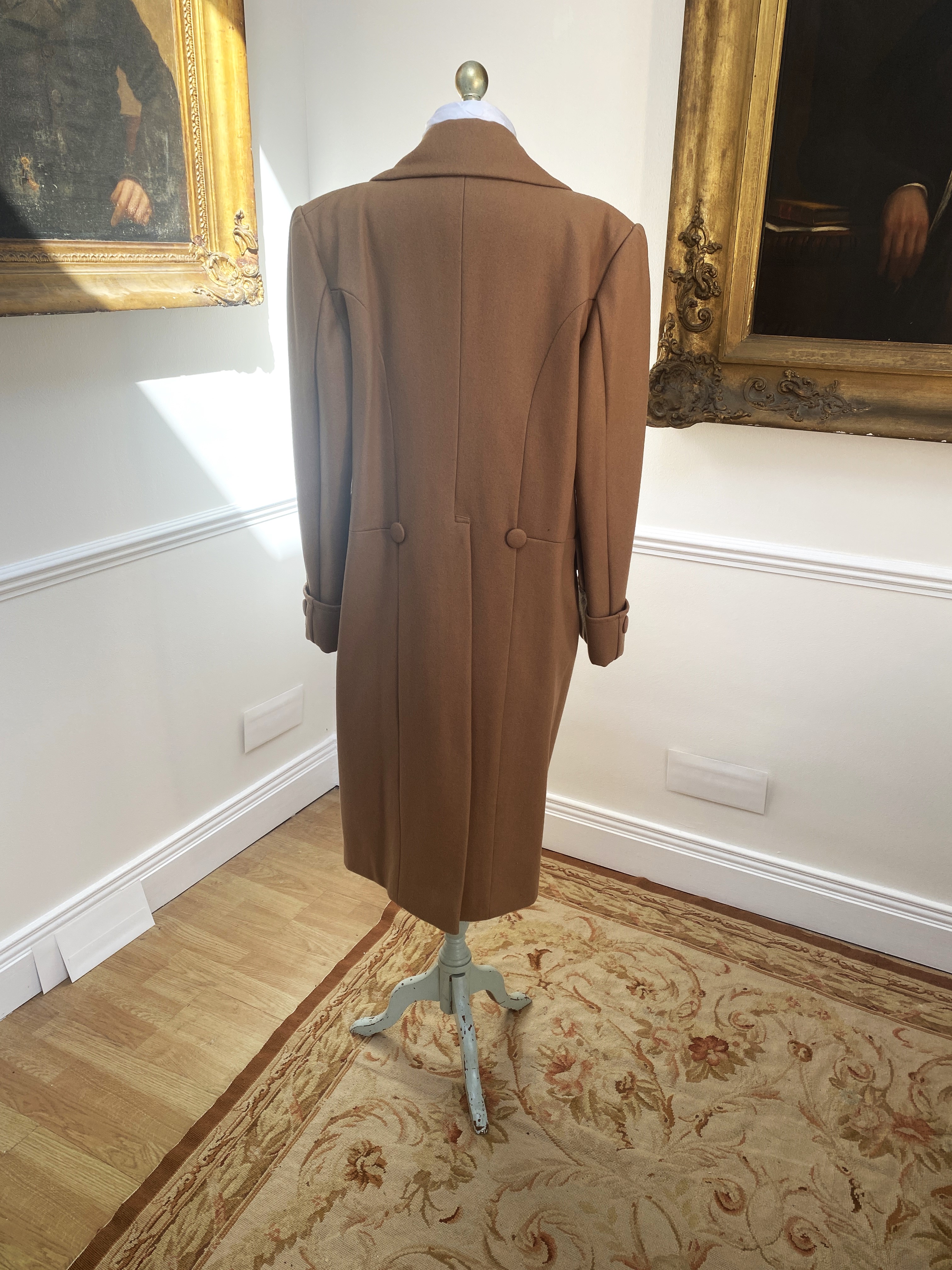 A camel men’s wool frock coat. Size Medium/Large. Condition - slight moth damage